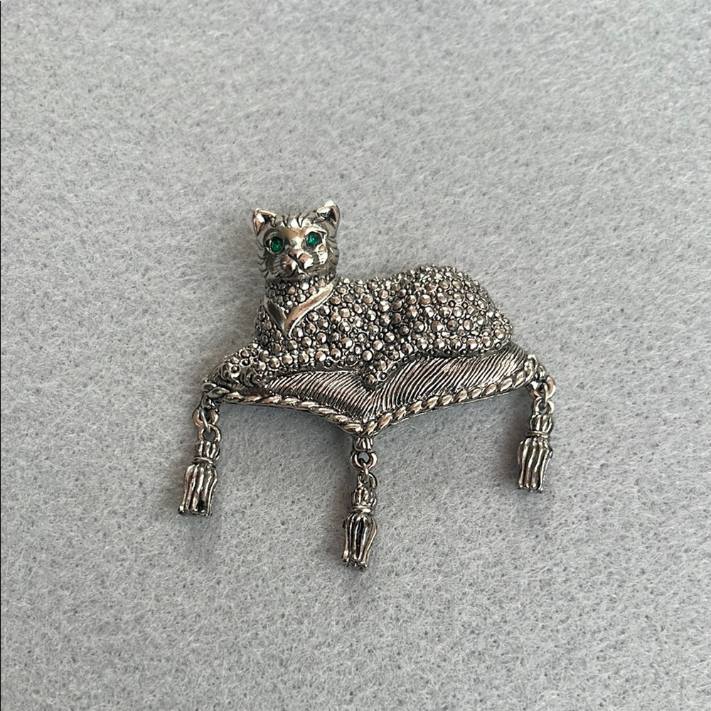 Charming Silver Cat Brooch with Green Accents